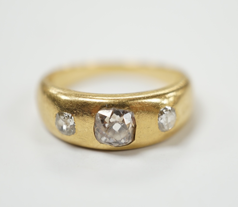 An 18ct and gypsy set three stone diamond ring, size G, gross weight 4.3 grams. Fair condition